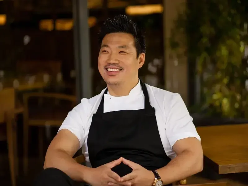 Chef Andrew Wong, smiling.