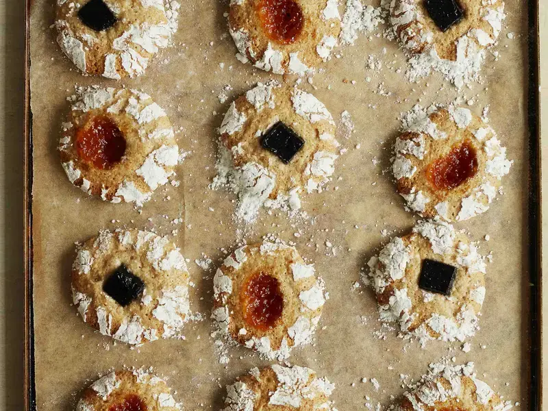 Hazlenut and jam biscuits by Twelve Triangles on a baking tray.