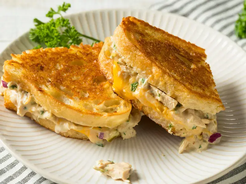 Tuna melt sandwich on a plate.