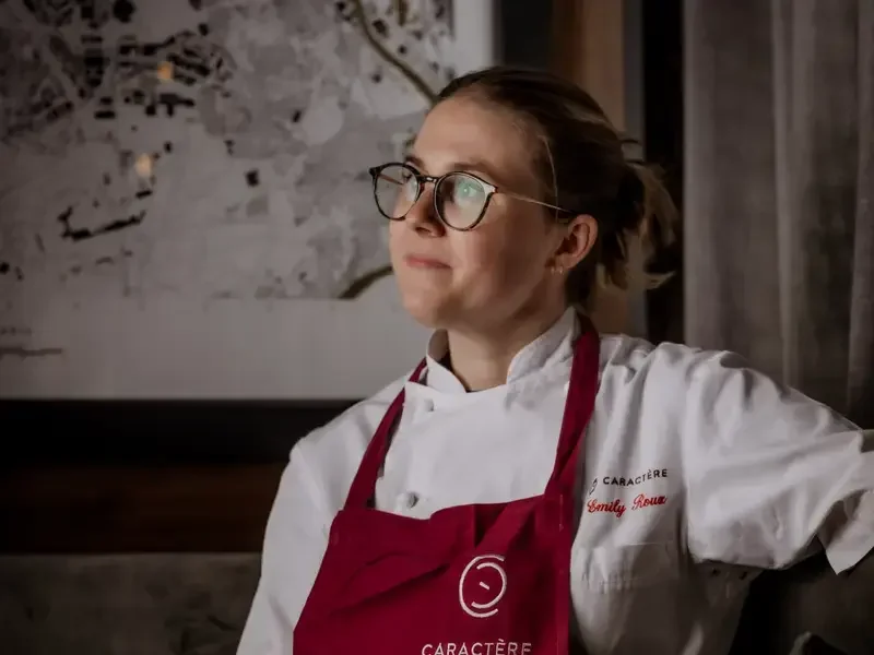 Chef Emily Roux in a red apron.