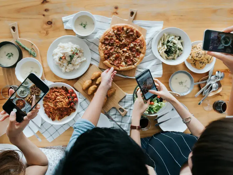 a group of food influencer taking pictures
