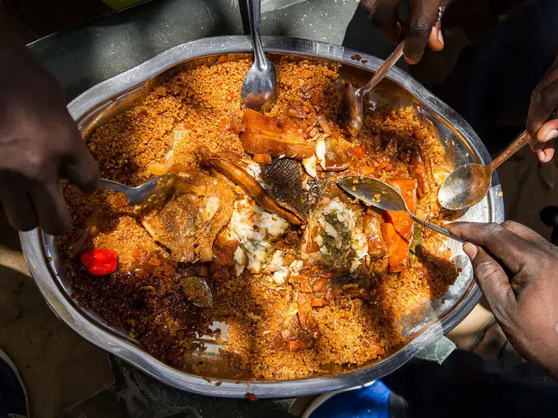 overhead-shot-large-platterof-food-with hands-holding-spoons