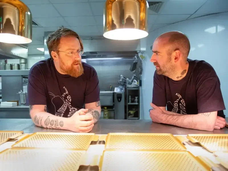 Chefs JPMcMahon and Andy McFadden in a kitchen.
