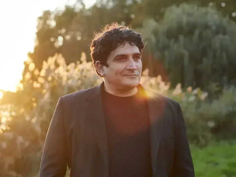 Chef Mauro Colagreco in a sunny garden.