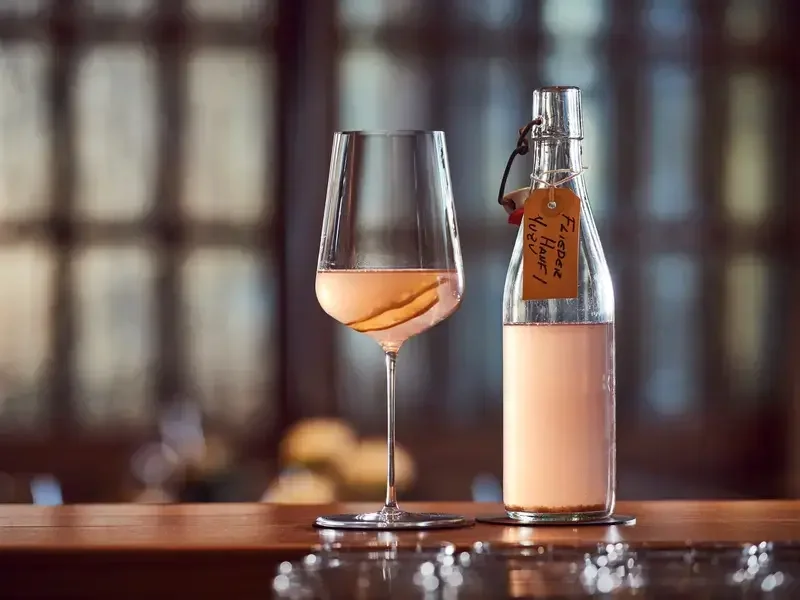 A glass and bottle.