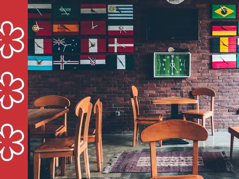Restaurant with flags on the wall.