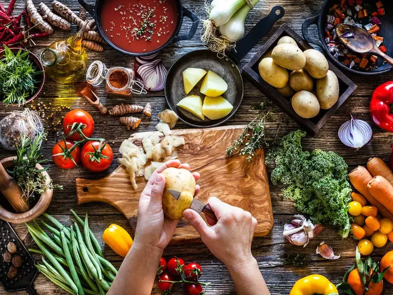 Woman cooking vegetarian meals.