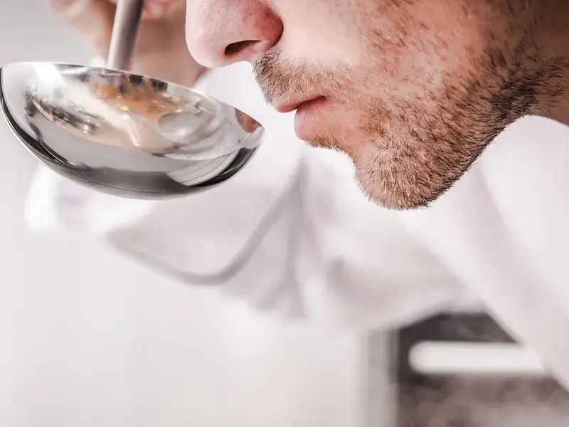 Chef tasting food