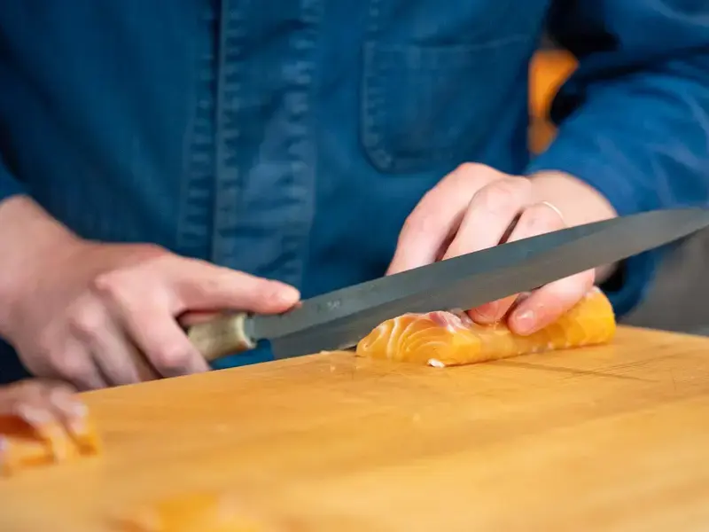 Slicing salmon at Affinity Fish.