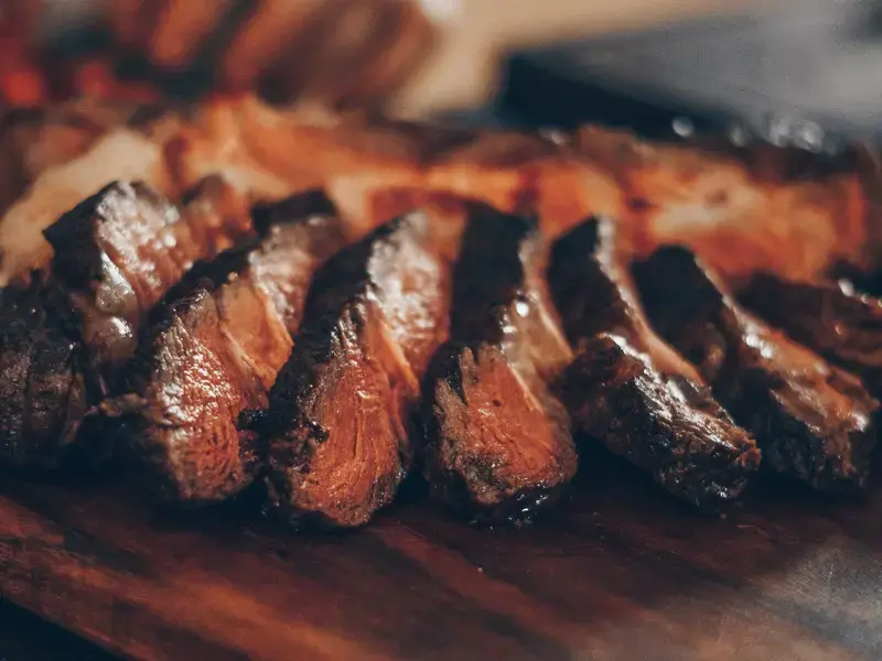 Medium cooked steak, sliced.