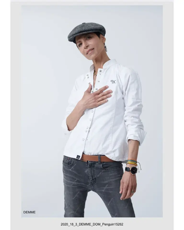 Chef Dominique Crenn in a flat cap.