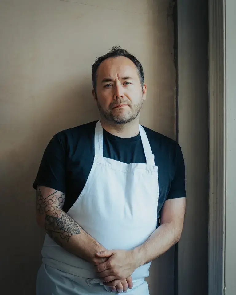 Chef Stuart Ralston in an apron.