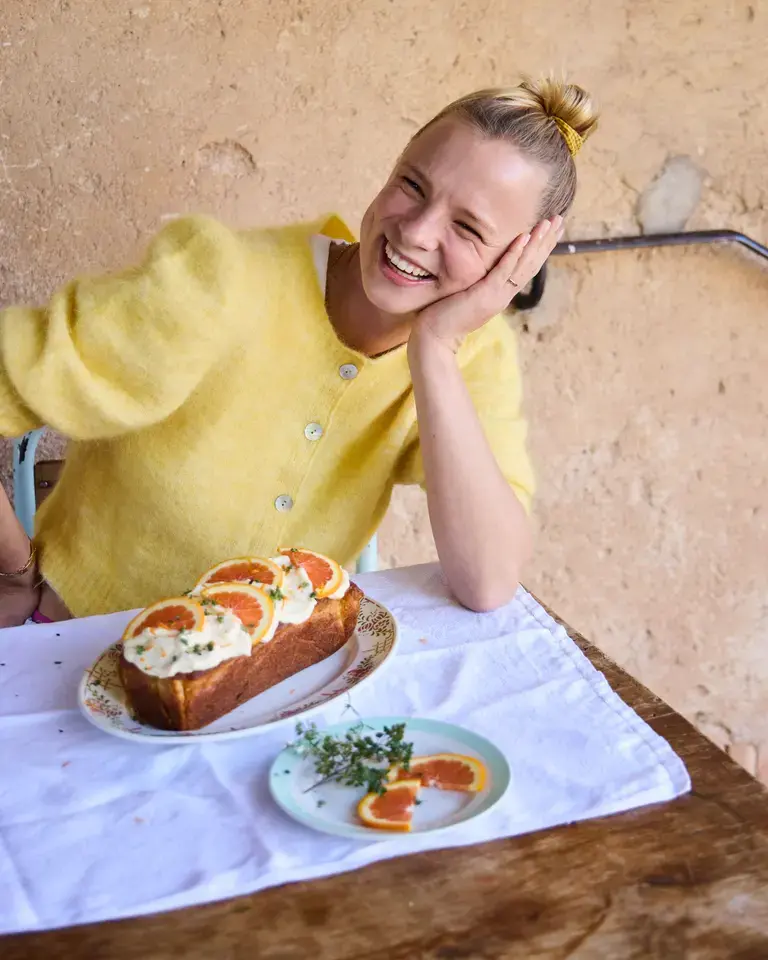 Xanthe Ross smiling in a yellow jumper.
