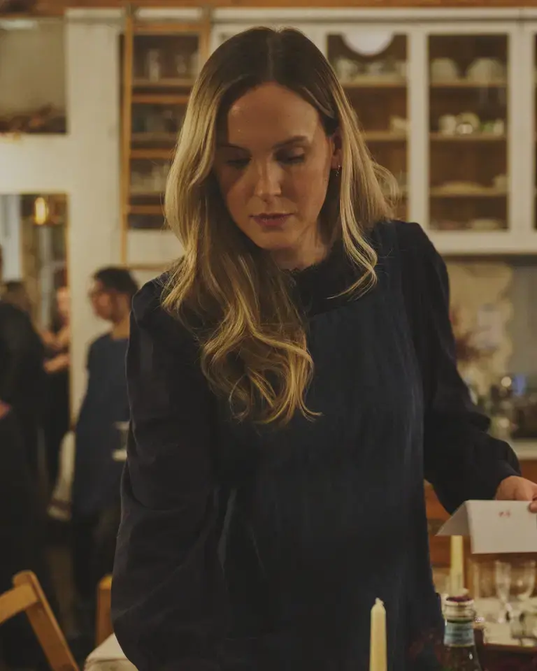 Creator Anna Laverty setting a table.