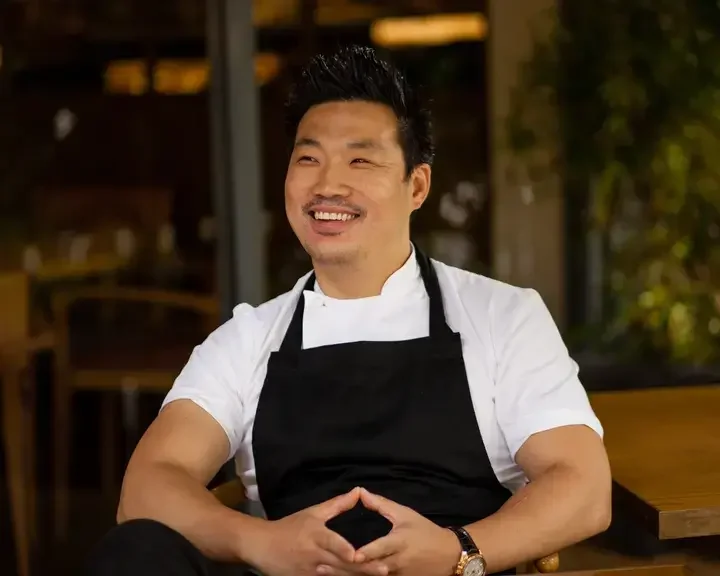 Chef Andrew Wong, smiling.