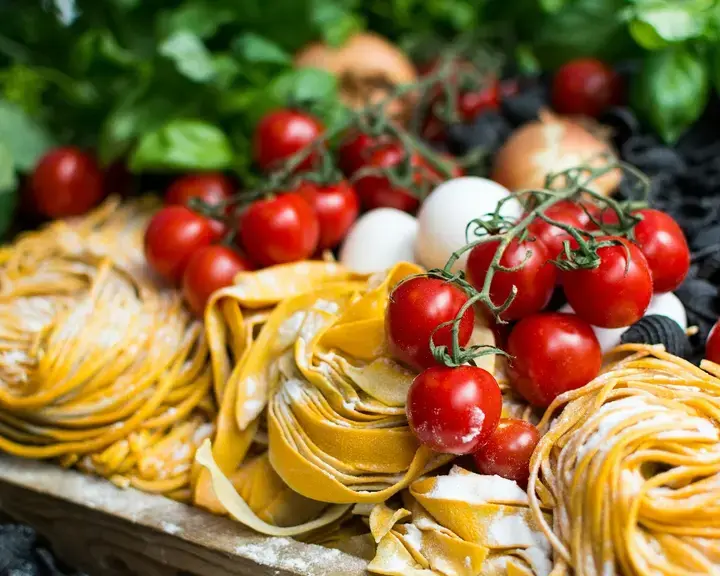 Raw fresh pasta and cherry tomatoes.