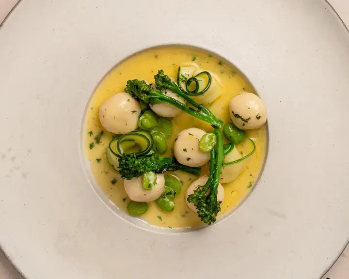 Gnudi with spring vegetables and lemon butter sauce by Stuart Ralston.