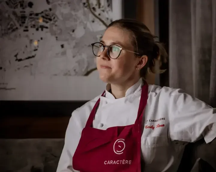 Chef Emily Roux in a red apron.