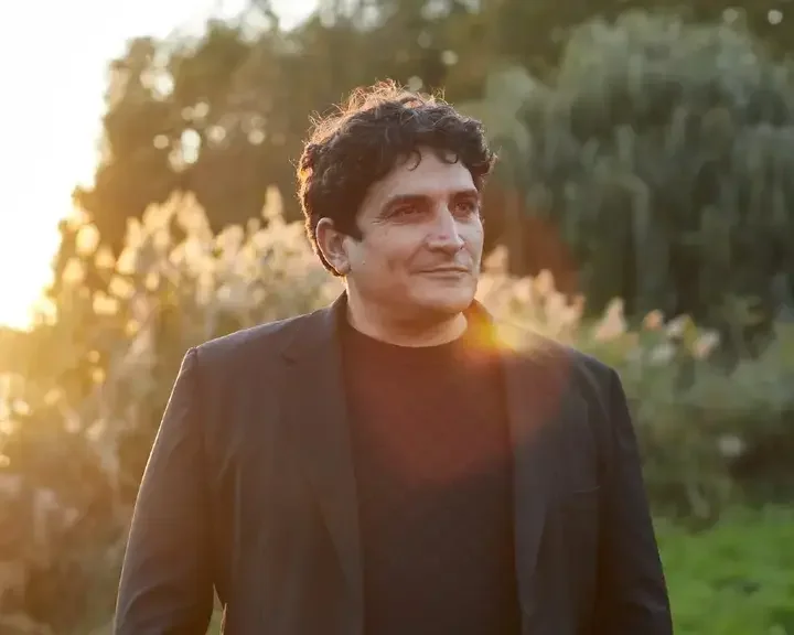 Chef Mauro Colagreco in a sunny garden.