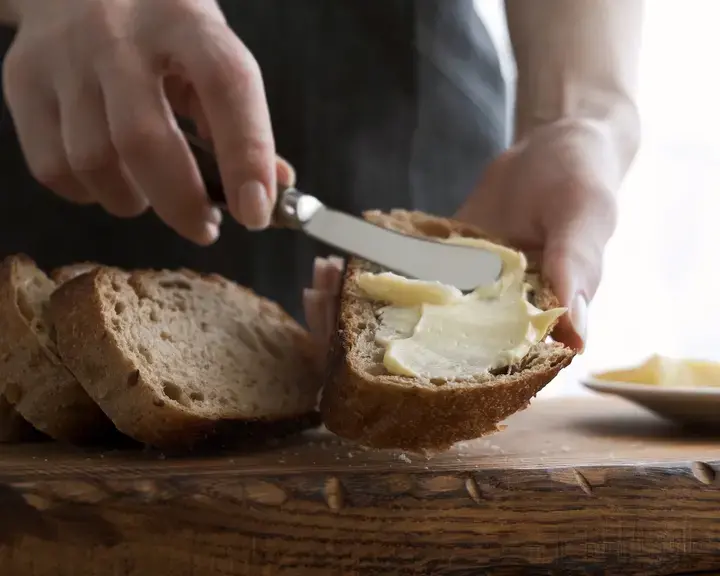butter-being-spread-on-bread-with-butter-knife